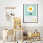 framed print of a flower on a new born babies nursery wall