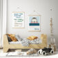 sealife nursery prints hung up in wooden hangers in a trendy scandi nursery