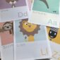 a selection of colourful animal alphabet prints to include lion, anteater, sloth, deer and zebra