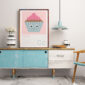 cupcake print on sideboard in trendy flat