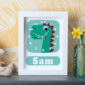 Personalised dinosaur clock on a shelf in a child’s bedroom